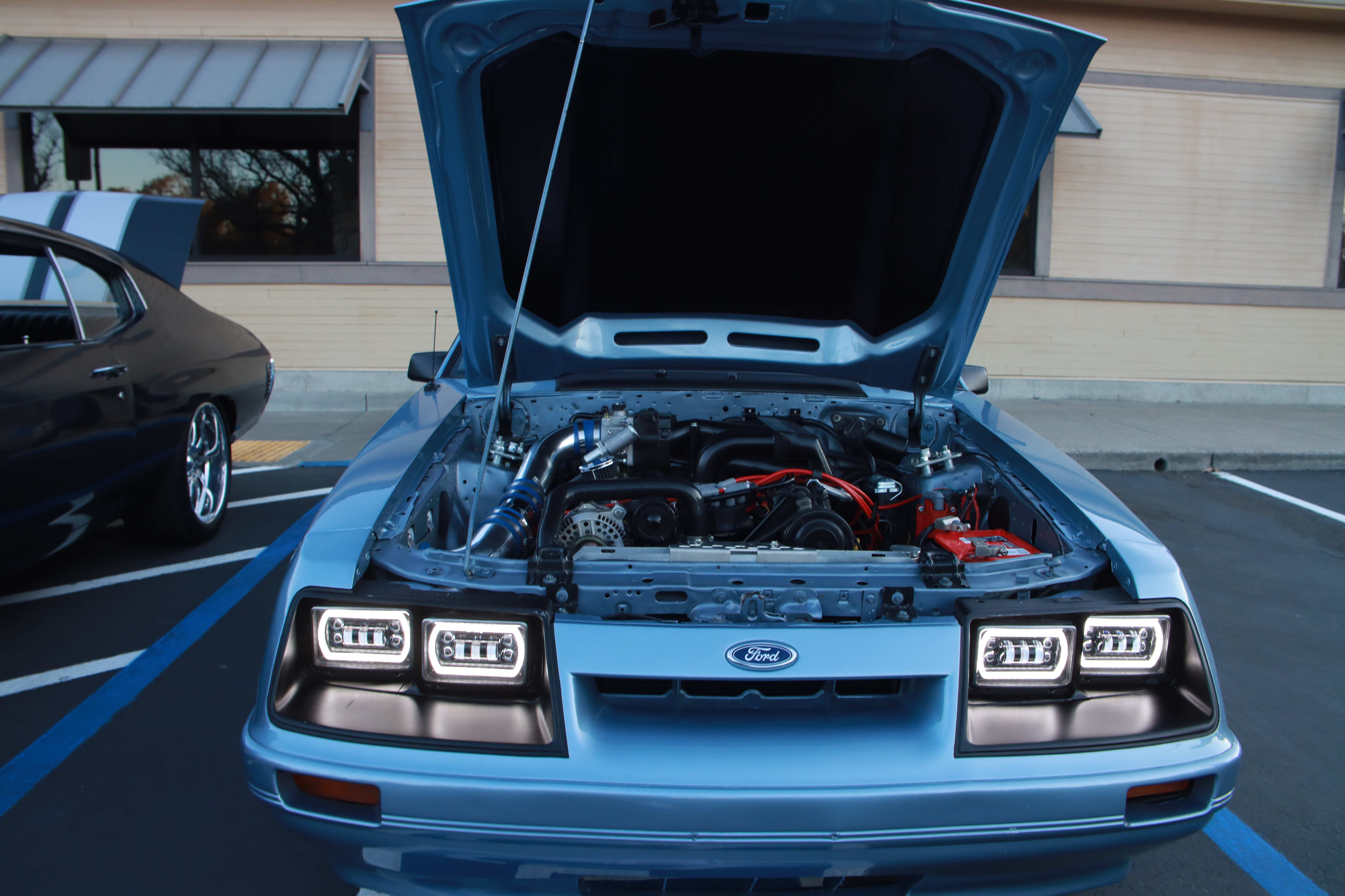 Pink Subaru WRX SERAMUN with Sailor Moon windshield graphics and anime flag