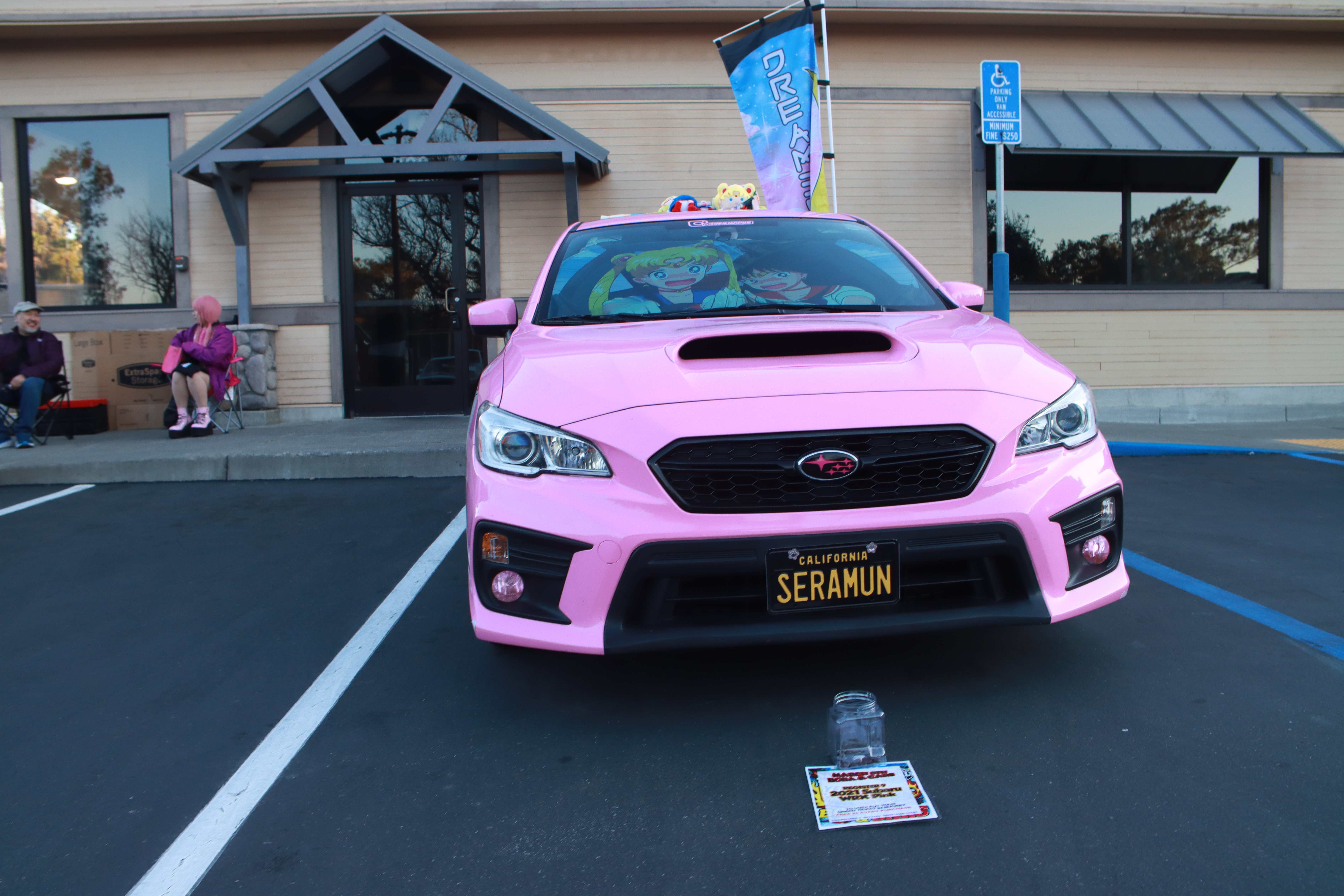 Pink Subaru WRX Sailor Moon build - front view with trophies on dash