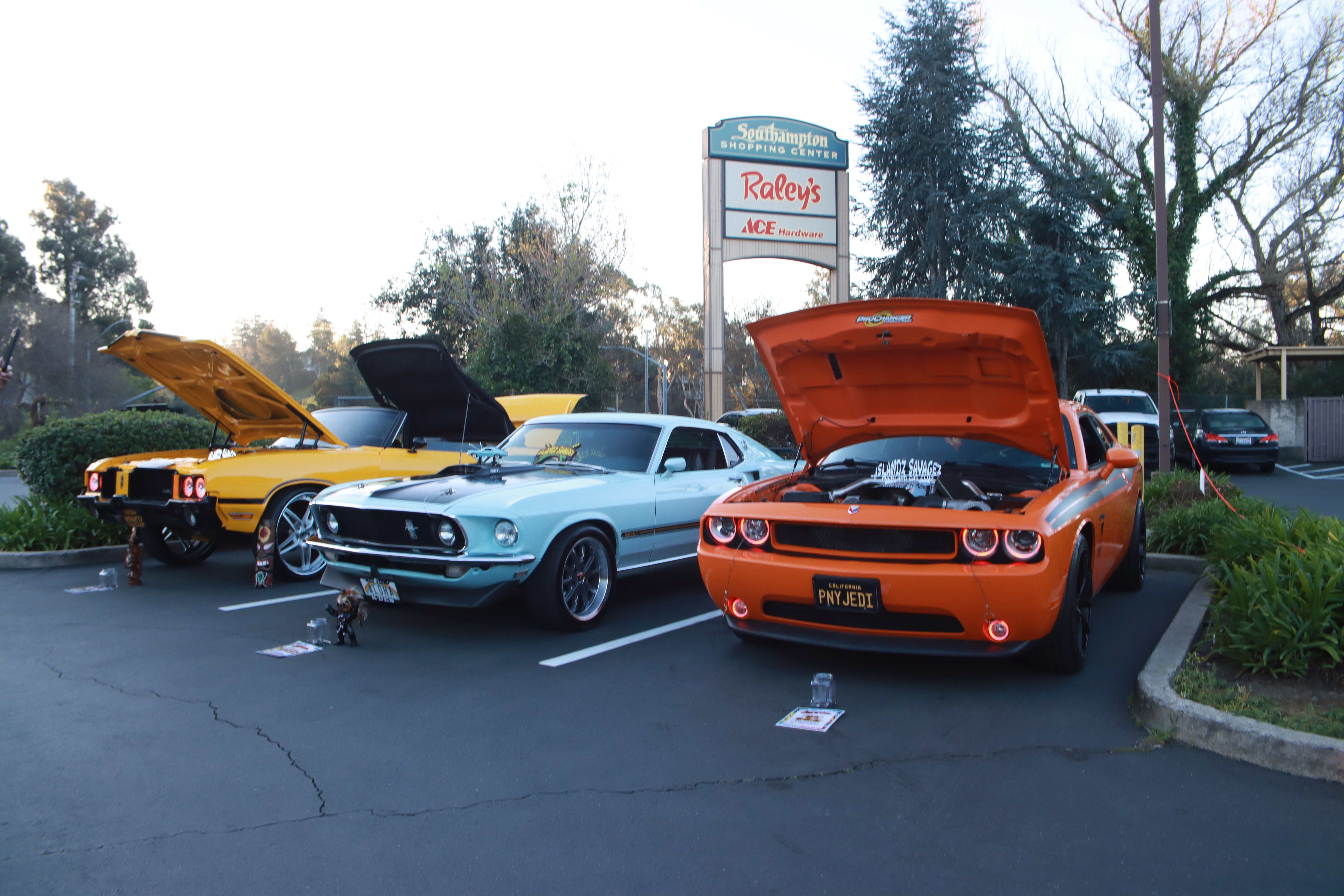 Yellow Mustang, light blue Mustang, and orange Challenger at Southampton Shopping Center