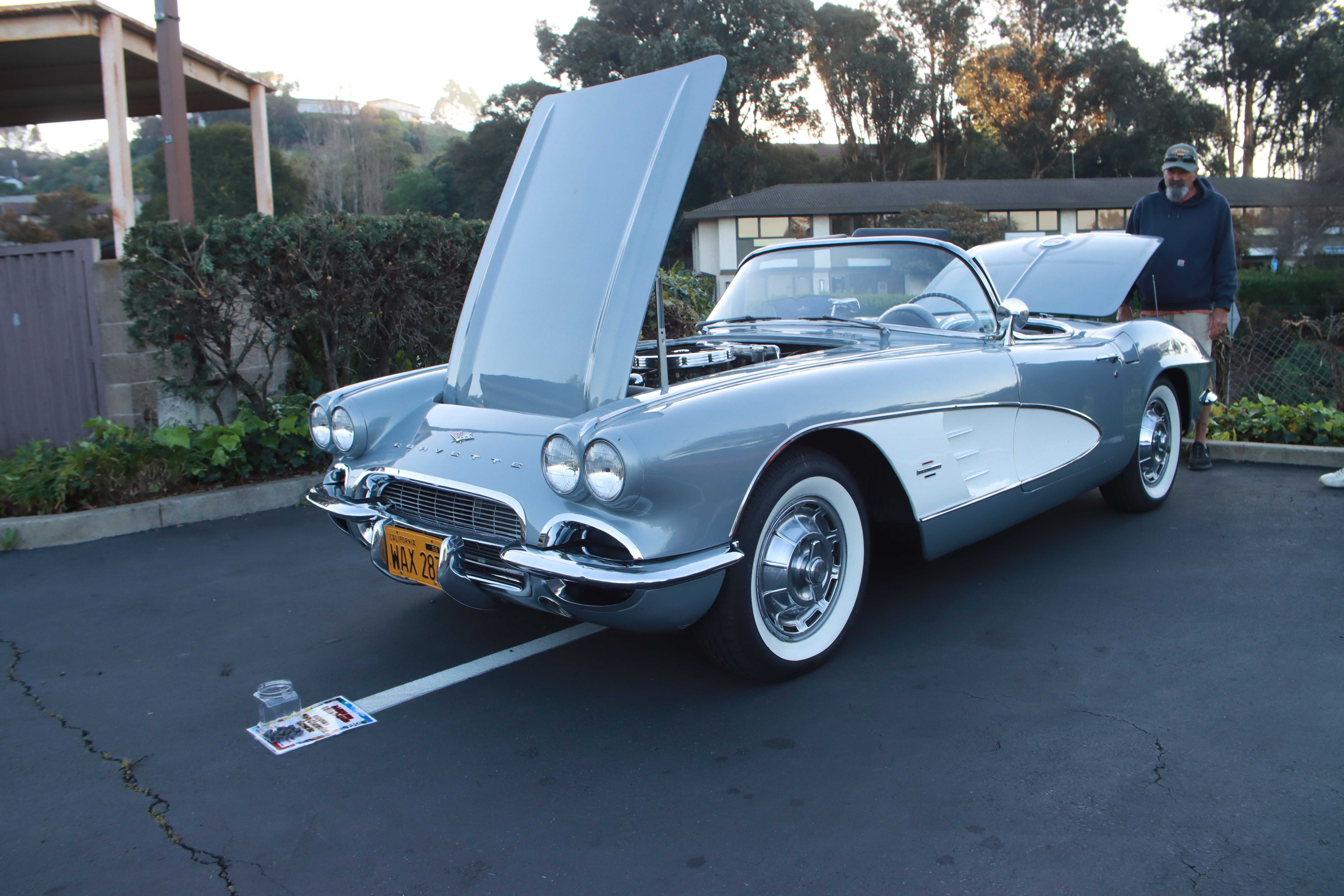 Light blue 1961 Chevrolet Corvette convertible with both hoods open